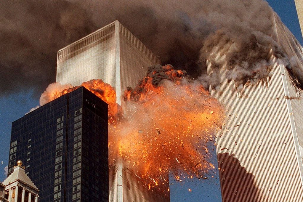 Smoke billows from one of the towers of the World Trade Center and flames and debris explode from the second tower, Tuesday, Sept. 11, 2001.