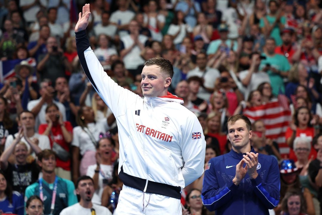 NANTERRE, FRANCE - JULY 28: Silver Medalist Adam Peaty of Team Great Britain acknowledges the fans during the Swimming medal ceremony after the Men’s 100m Breaststroke Final on day two of the Olympic Games Paris 2024 at Paris La Defense Arena on July 28, 2024 in Nanterre, France. (Photo by Quinn Rooney/Getty Images)