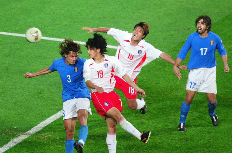 South Korean midfielder Ahn Jung-hwan (2nd L) heads the ball past Italian defender Paolo Maldini (L-#3) for a 'golden goal' in their second round match at the 2002 FIFA World Cup Korea/Japan in Daejeon, 18 June 2002.  South Korea won the match 2-1 in extra time on Ahn's goal and will meet Spain in the quarter-finals 22 June in Gwangju.      AFP PHOTO/Jacques DEMARTHON (Photo credit should read JACQUES DEMARTHON/AFP via Getty Images)