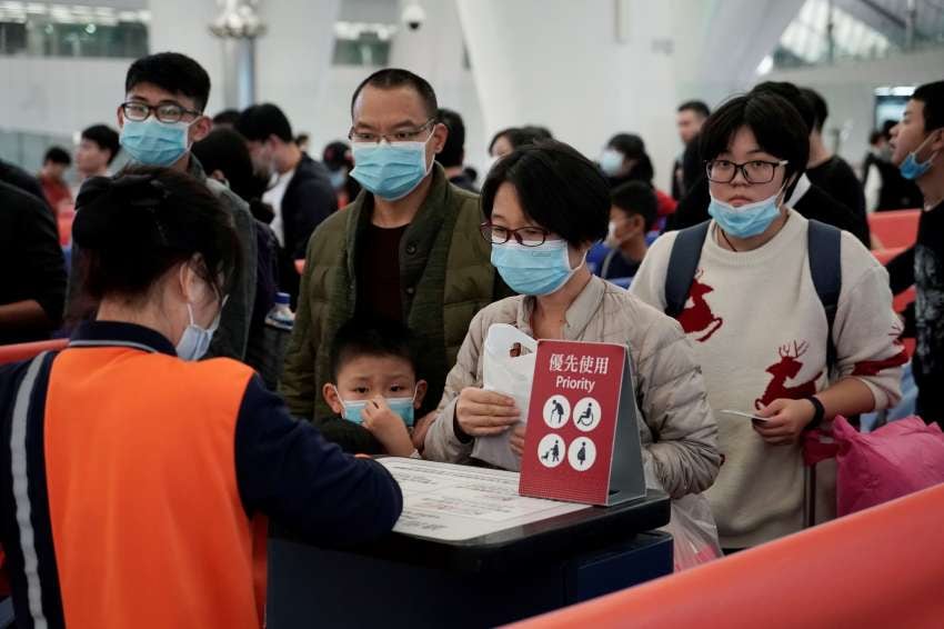 
Passengers wear masks to prevent an outbreak of a new coronavirus in the high speed train station, in Hong Kong | AP
   