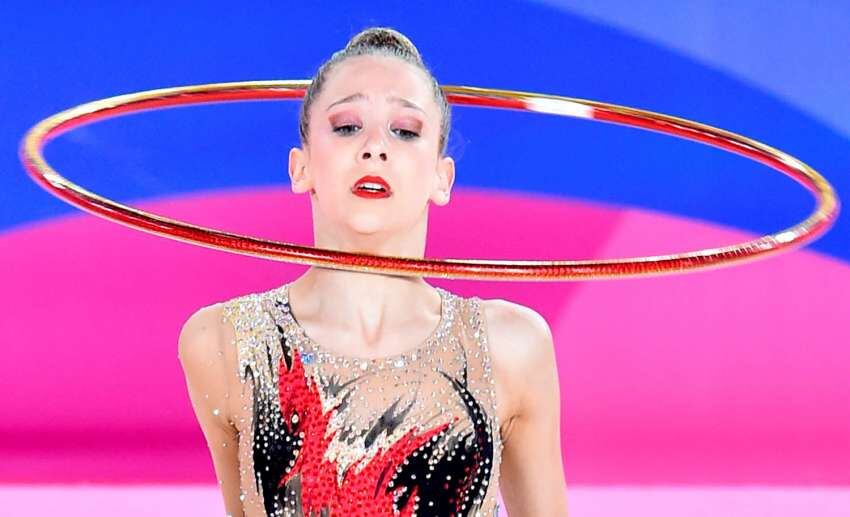 
Foto: AFP | La argentina Sol Fainberg realiza su rutina en la competencia Final de Aro de Gimnasia Rítmica Individual.
   