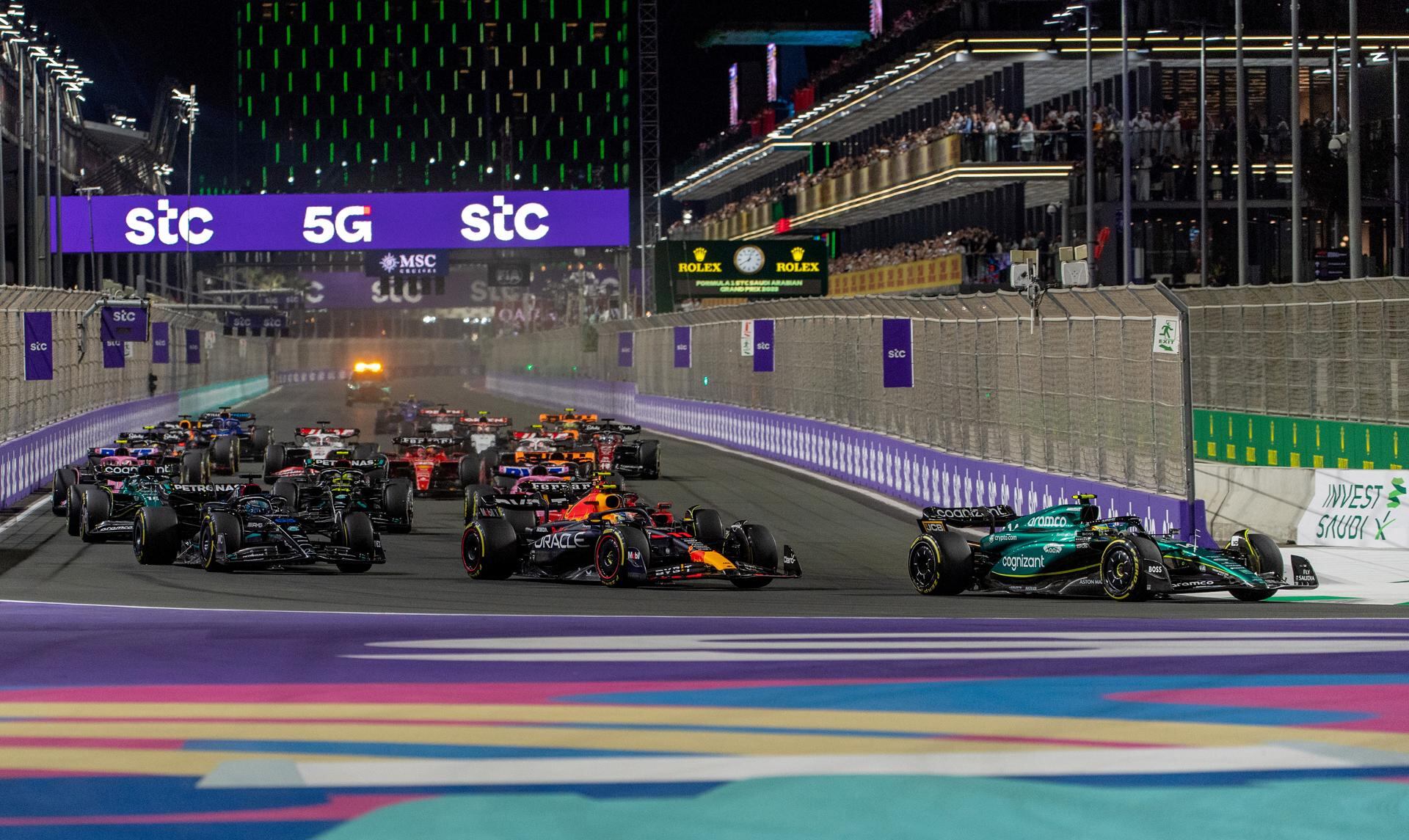 Jeddah (Saudi Arabia), 19/03/2023.- Winner Mexican driver Sergio Perez (C) of Red Bull Racing, second placed Dutch driver Max Verstappen (L) of Red Bull Racing and third placed Spanish driver Fernando Alonso of Aston Martin during the podium ceremony for the Formula One Grand Prix of Saudi Arabia at the Jeddah Corniche Circuit, Saudi Arabia, 19 March 2023. (Fórmula Uno, Arabia Saudita) EFE/EPA/STR
