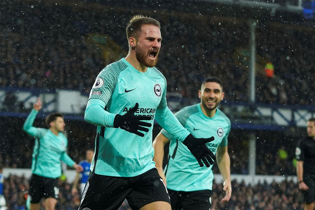 Brighton's Alexis Mac Allister celebrates after scoring the opening goal during the English Premier League soccer match between Everton and Brighton at Goodison Park stadium in Liverpool, England,