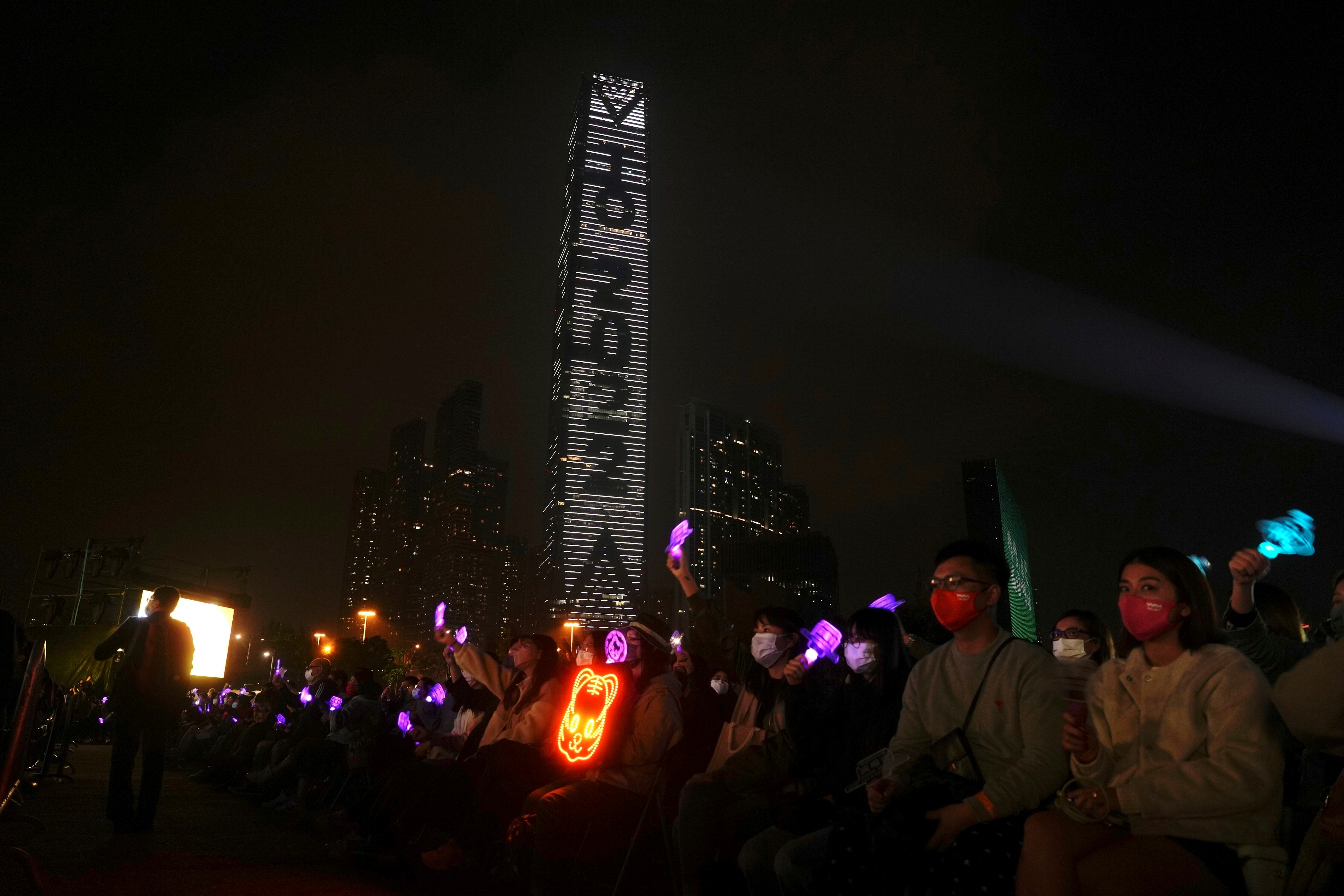 People celebrate during a New Year's Eve concert in Hong Kong